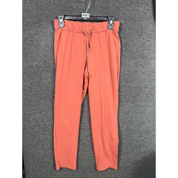 Lululemon On The Fly 7/8 Pants Womens Size 4 Red Dust Travel Woven Drawstring - Picture 1 of 7